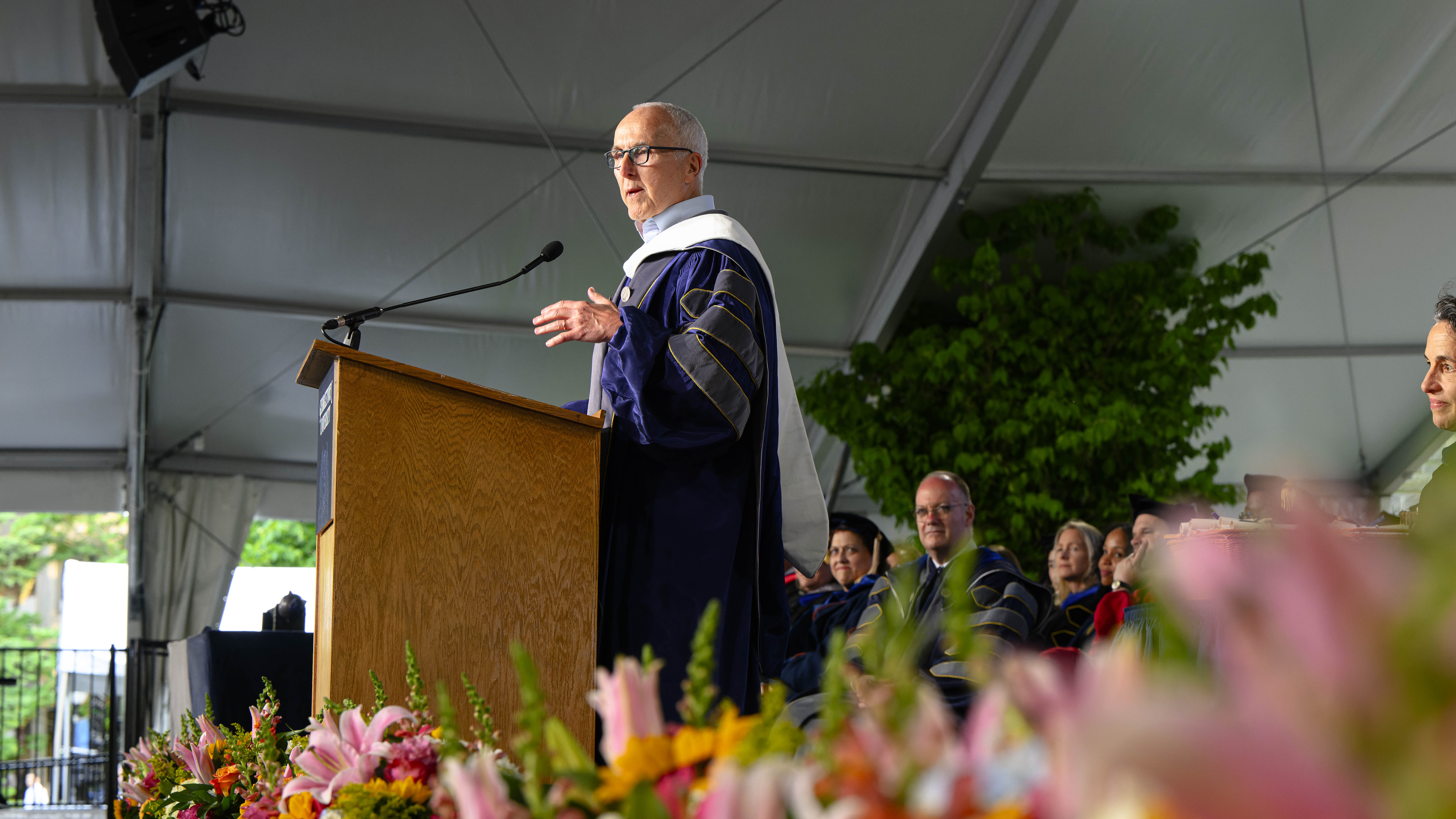 Frank McCourt delivering the 2023 commencement speech for the McCourt School of Public Policy at Georgetown University