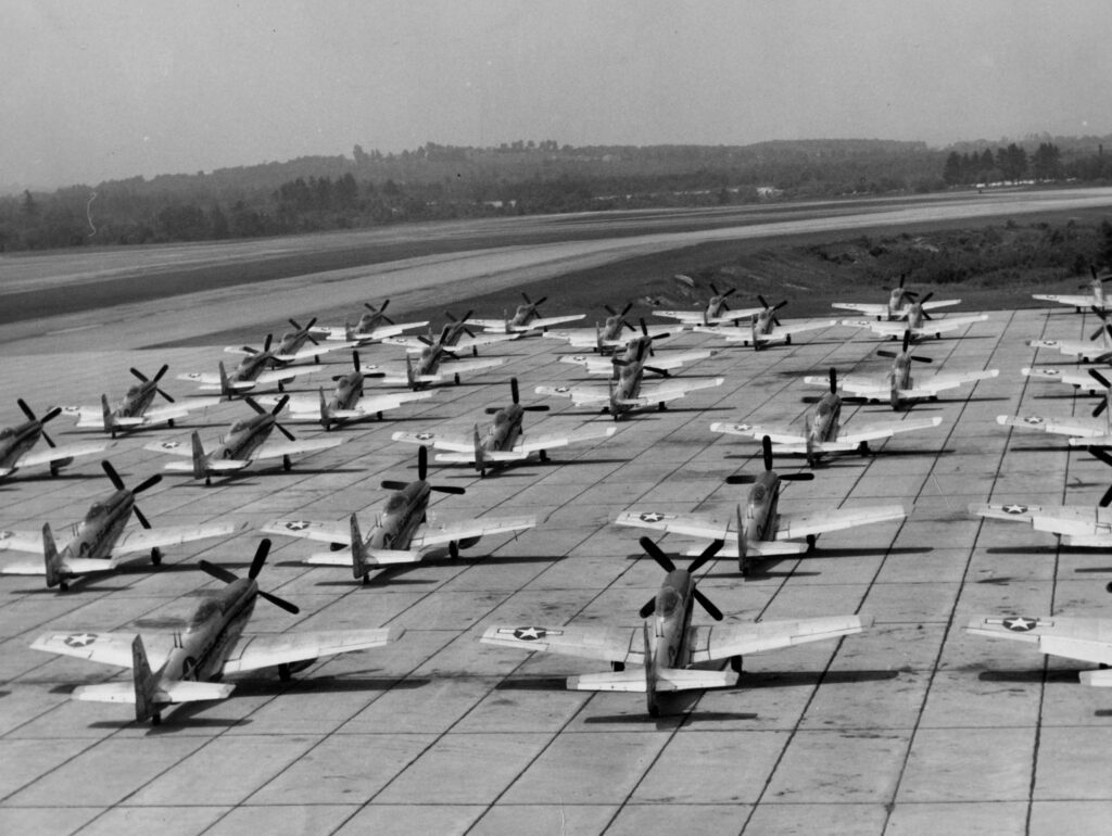 black-and-white; airfield of WWII-era military planes