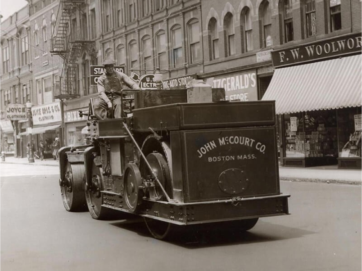 black-and-white; John McCourt Co. roller truck on a Boston street in the early 20th century